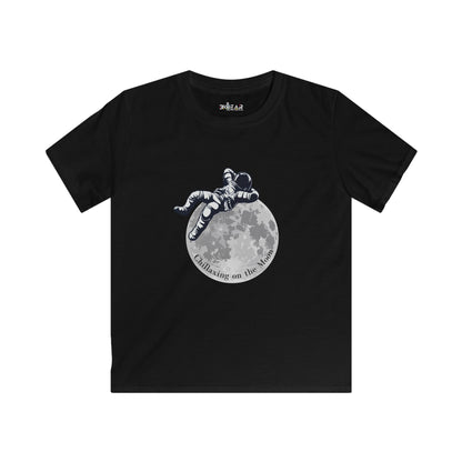 Black kids moon kids tee with astronaut lounging on the moon graphic by Printify