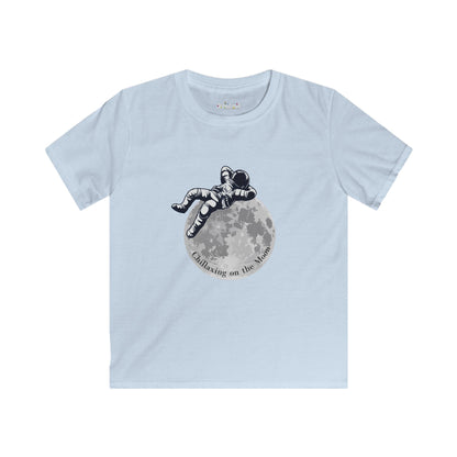 Light blue kids moon kids tee featuring an astronaut relaxing on the moon graphic