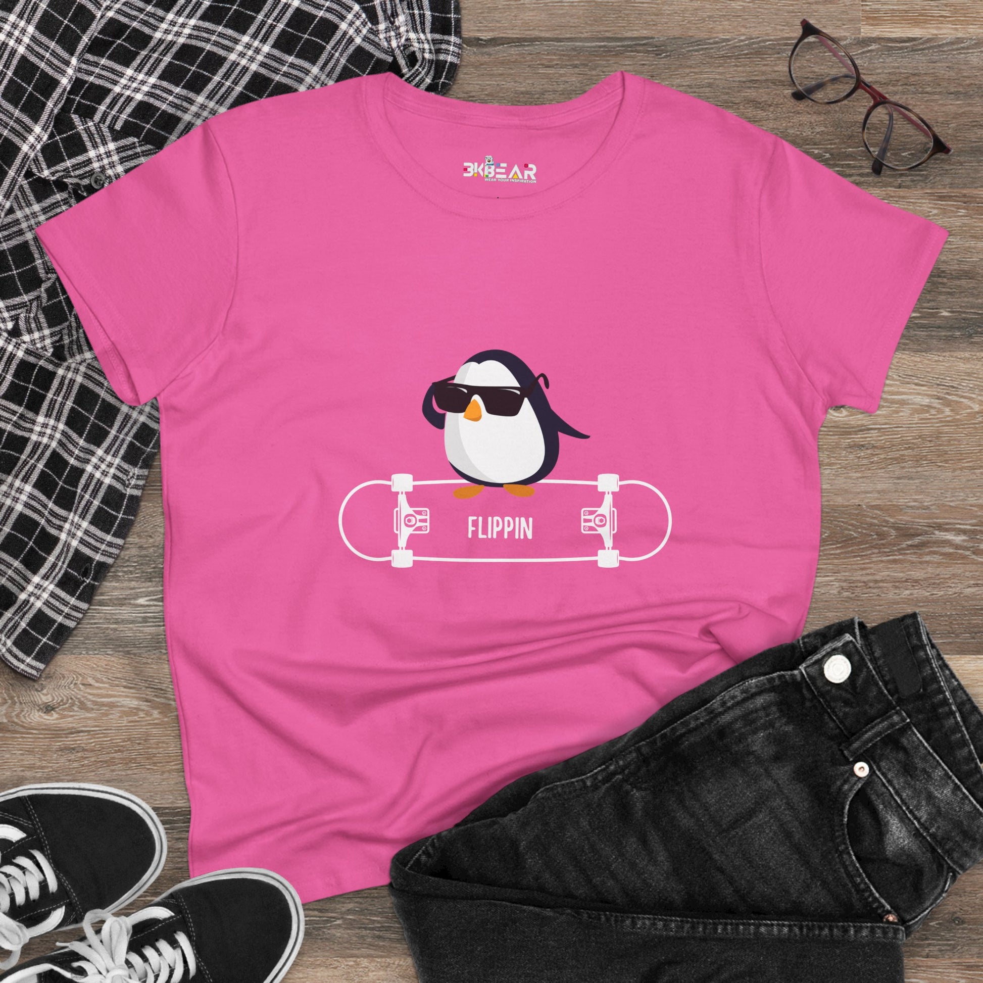 Pink Adélie penguin tee with cartoon penguin on skateboard wearing sunglasses