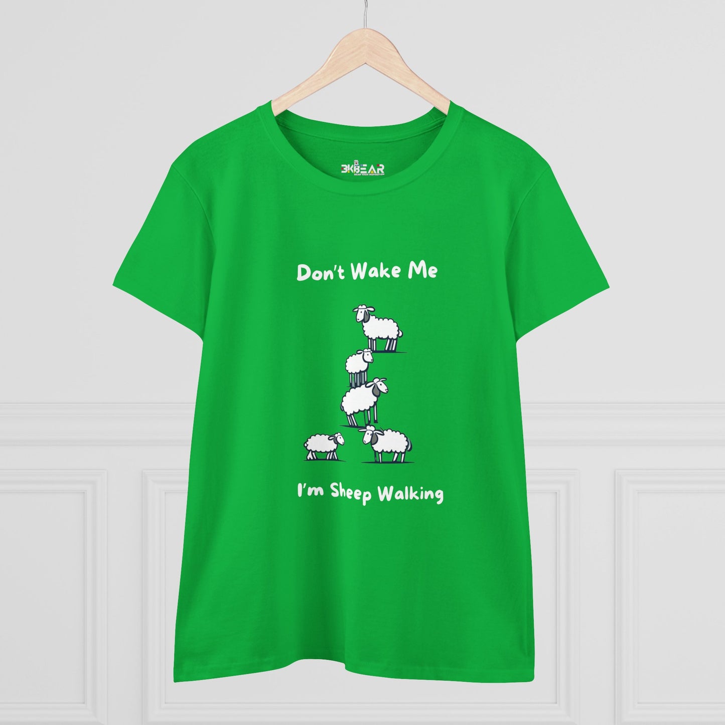 Green funny sheep graphic t-shirt with cartoon sheep stacking and text Dont Wake Me Im Sheep Walking