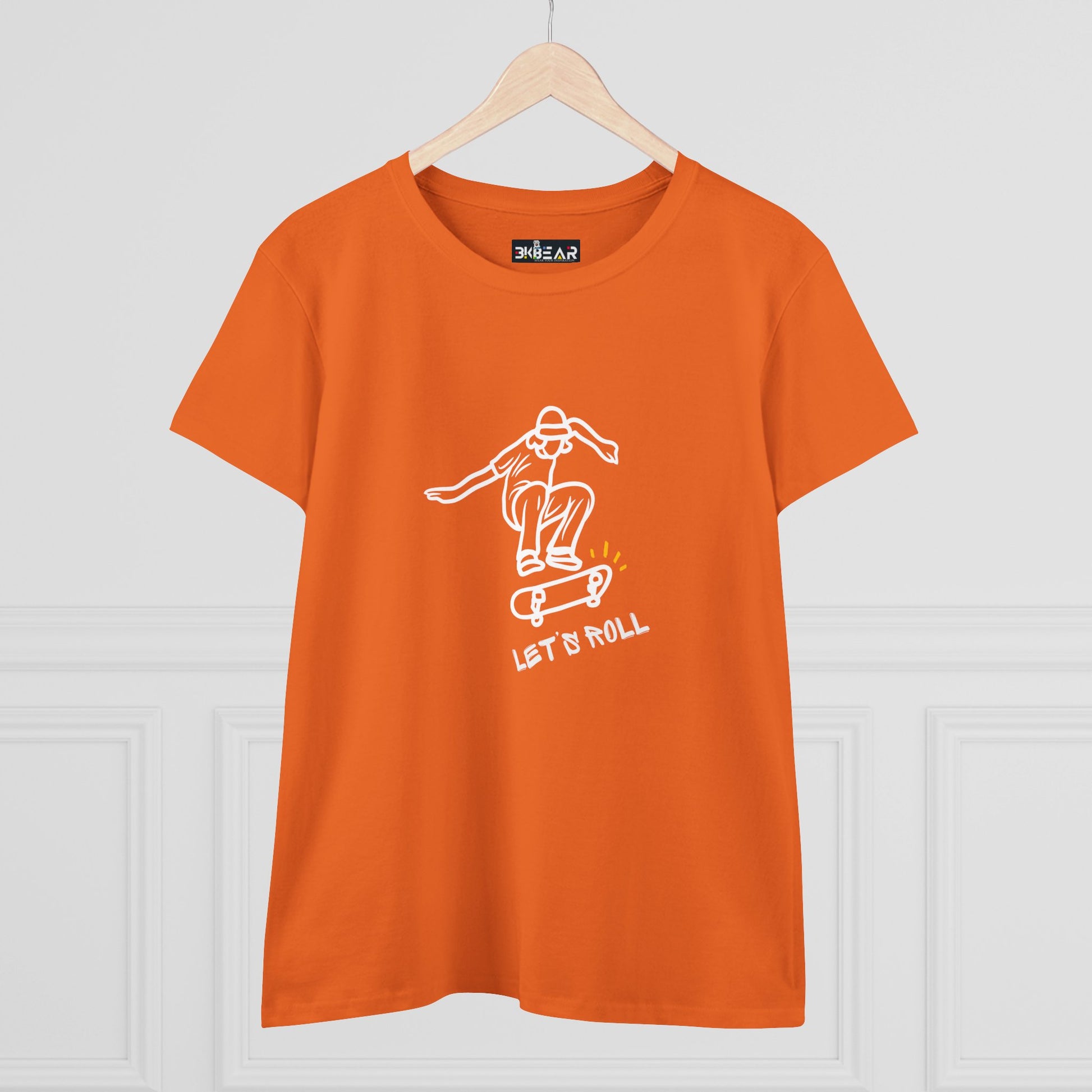 Orange Printify T-shirt with white skateboarder graphic and Let’s Roll shirt text