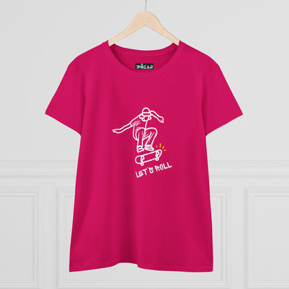 Pink Printify Let’s Roll shirt with white skateboarder graphic hanging on wooden hanger