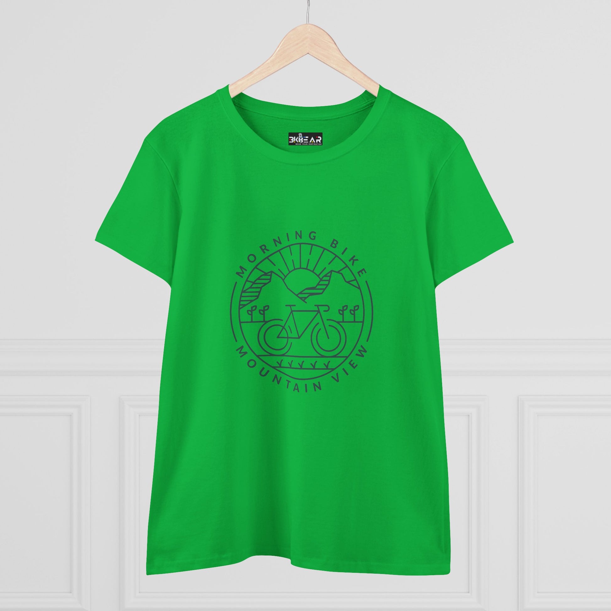Green Printify morning bike t-shirt with mountain and bicycle graphic on front