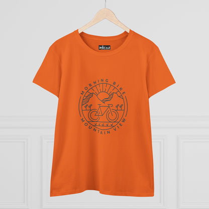 Orange Printify morning bike t-shirt featuring a mountain and bike graphic with sunrise design