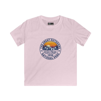 Light pink kids shirt with mountain and sunset print featuring never stop exploring kids shirt design