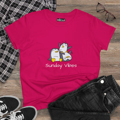 Bright pink sunday vibes graphic tee with playful cartoon penguins printed on front