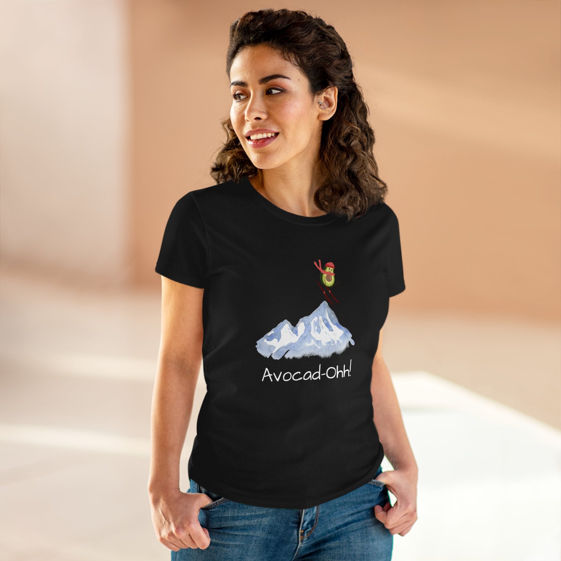 Printify avocado graphic tee women black t-shirt with playful avocado skiing on mountain design