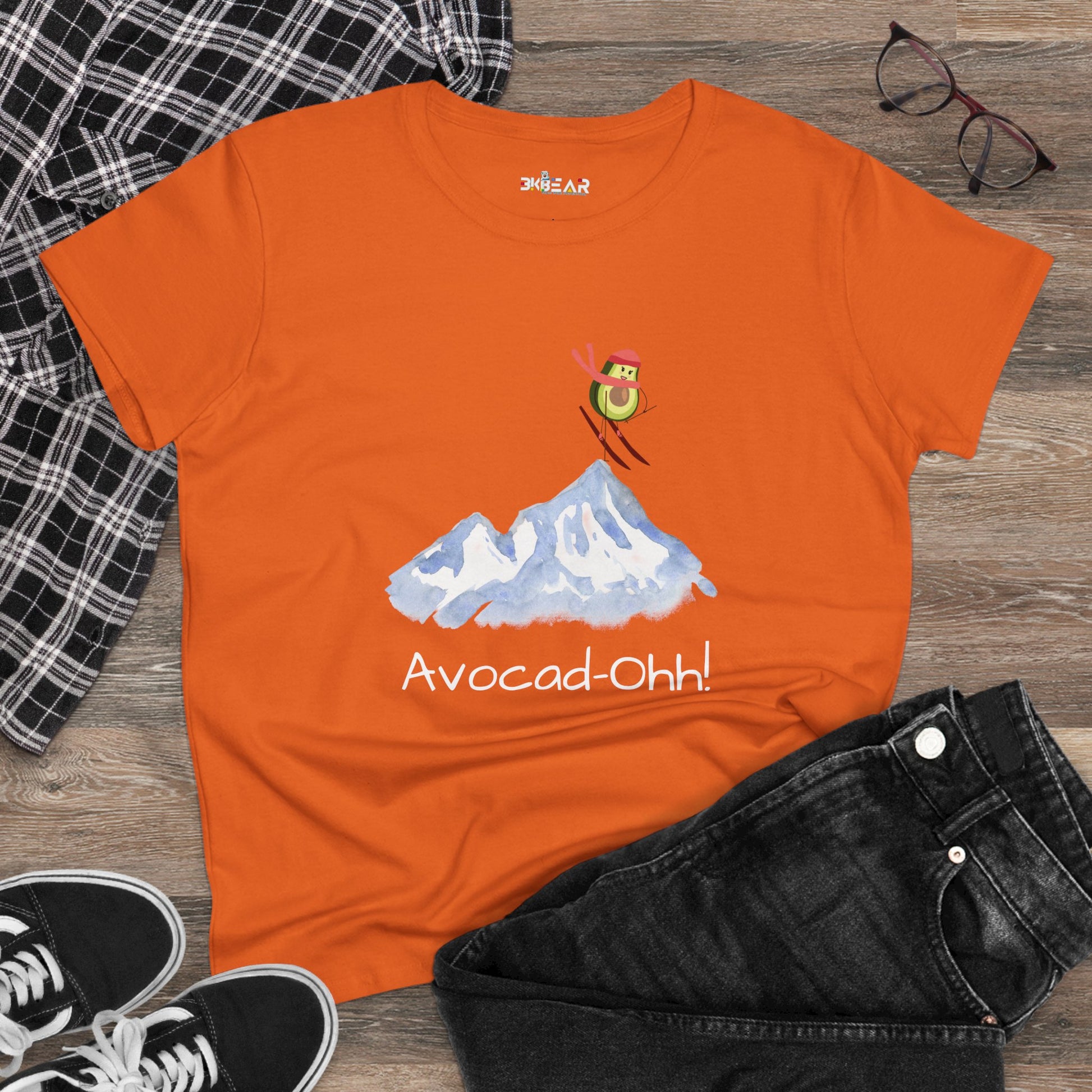 Orange Printify avocado graphic tee women with skiing avocado and mountain design