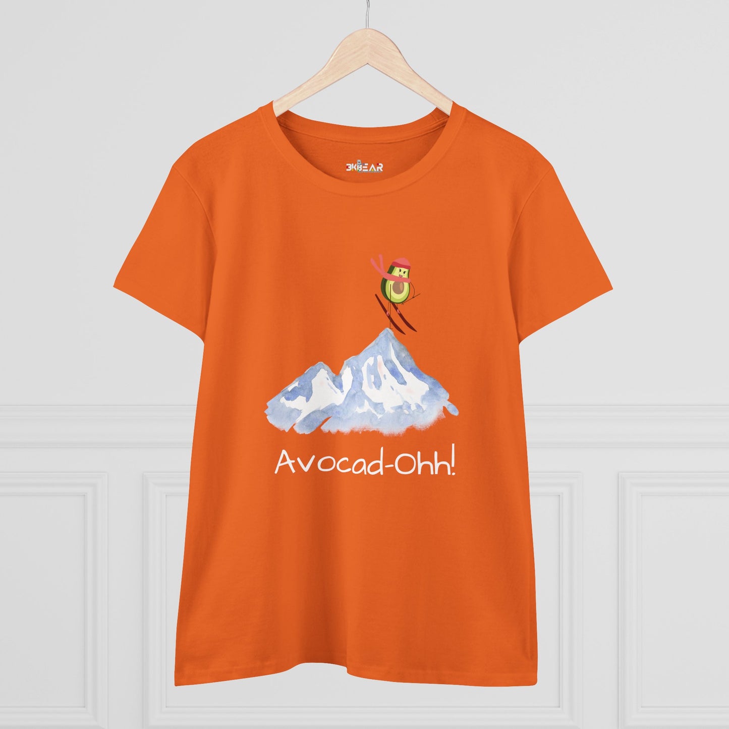 Orange Printify t-shirt featuring avocado graphic tee women design with skiing avocado and mountain