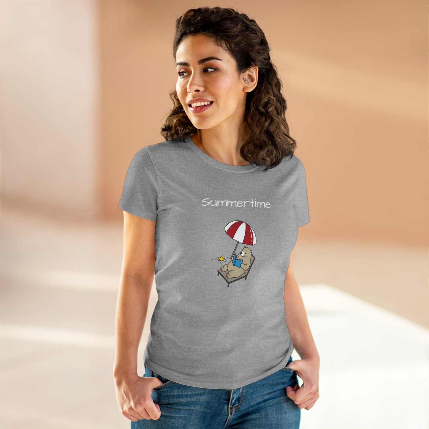 Woman wearing gray bear graphic t-shirt with bear lounging under umbrella and summertime text