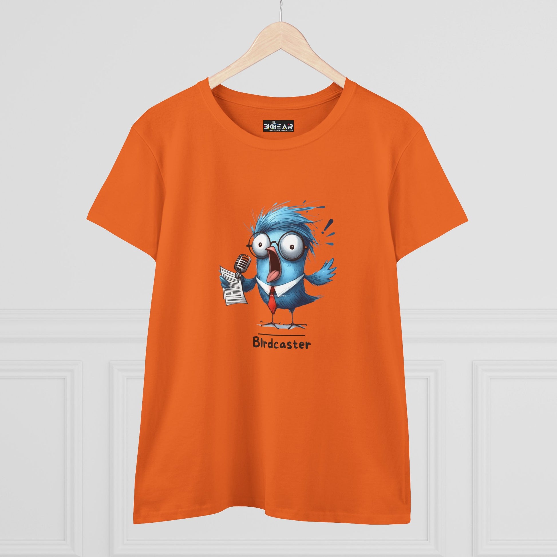 Orange Printify T-shirt with cartoon blue bird holding microphone and paper bird lover shirt women
