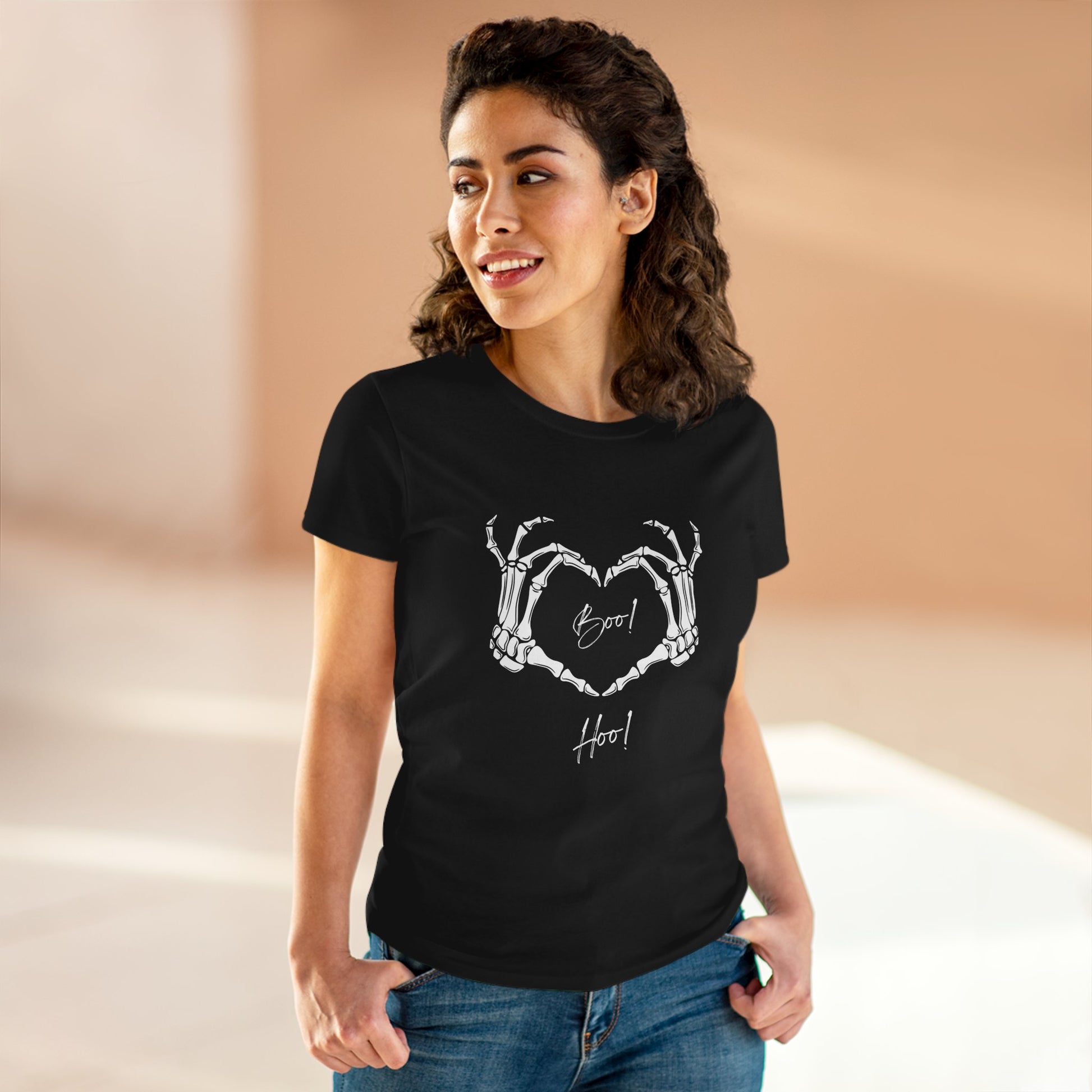 Black boo hoo t-shirt women with skeleton hand heart design worn by smiling woman in casual jeans