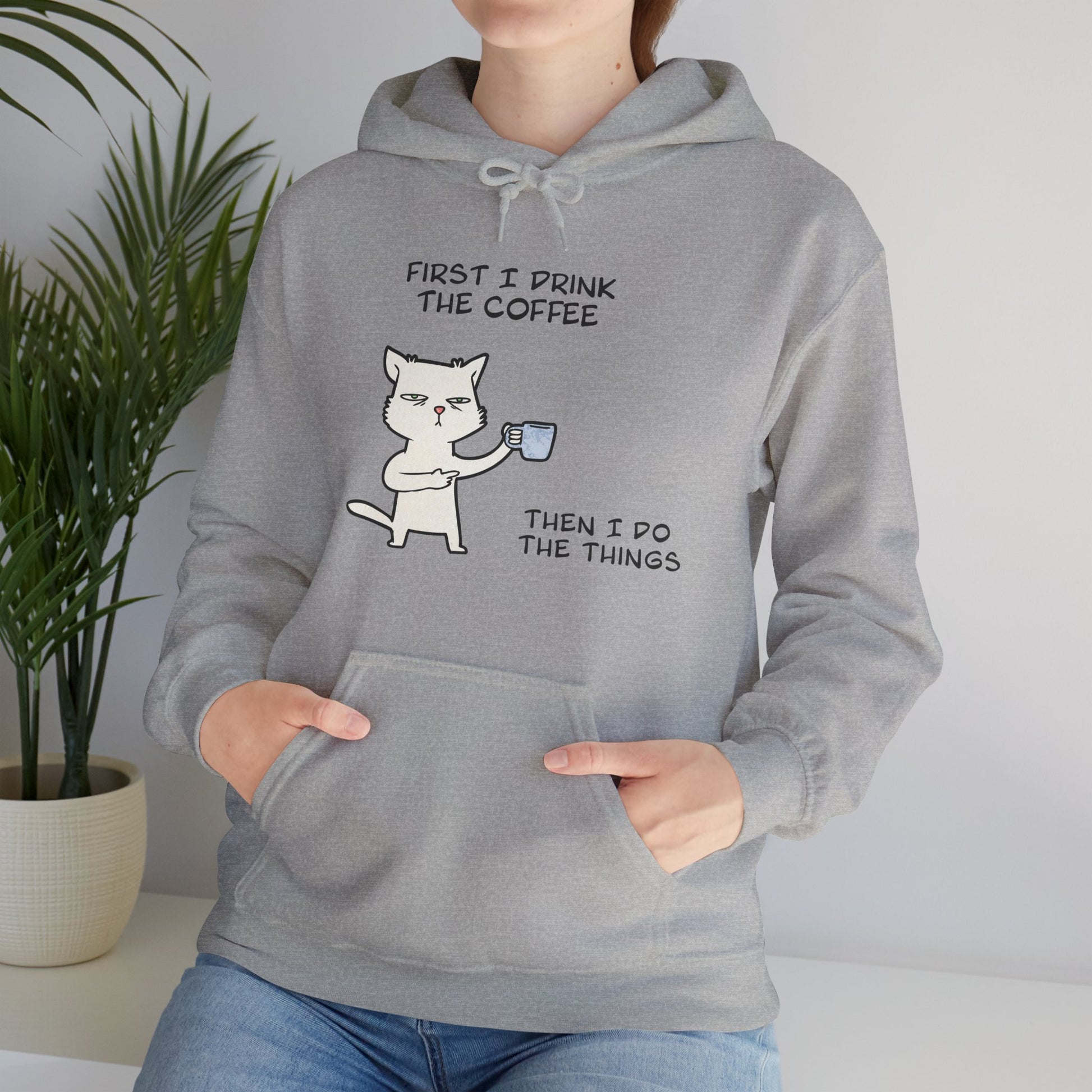 Printify but first coffee hoodie in gray with cartoon cat holding coffee cup and text design