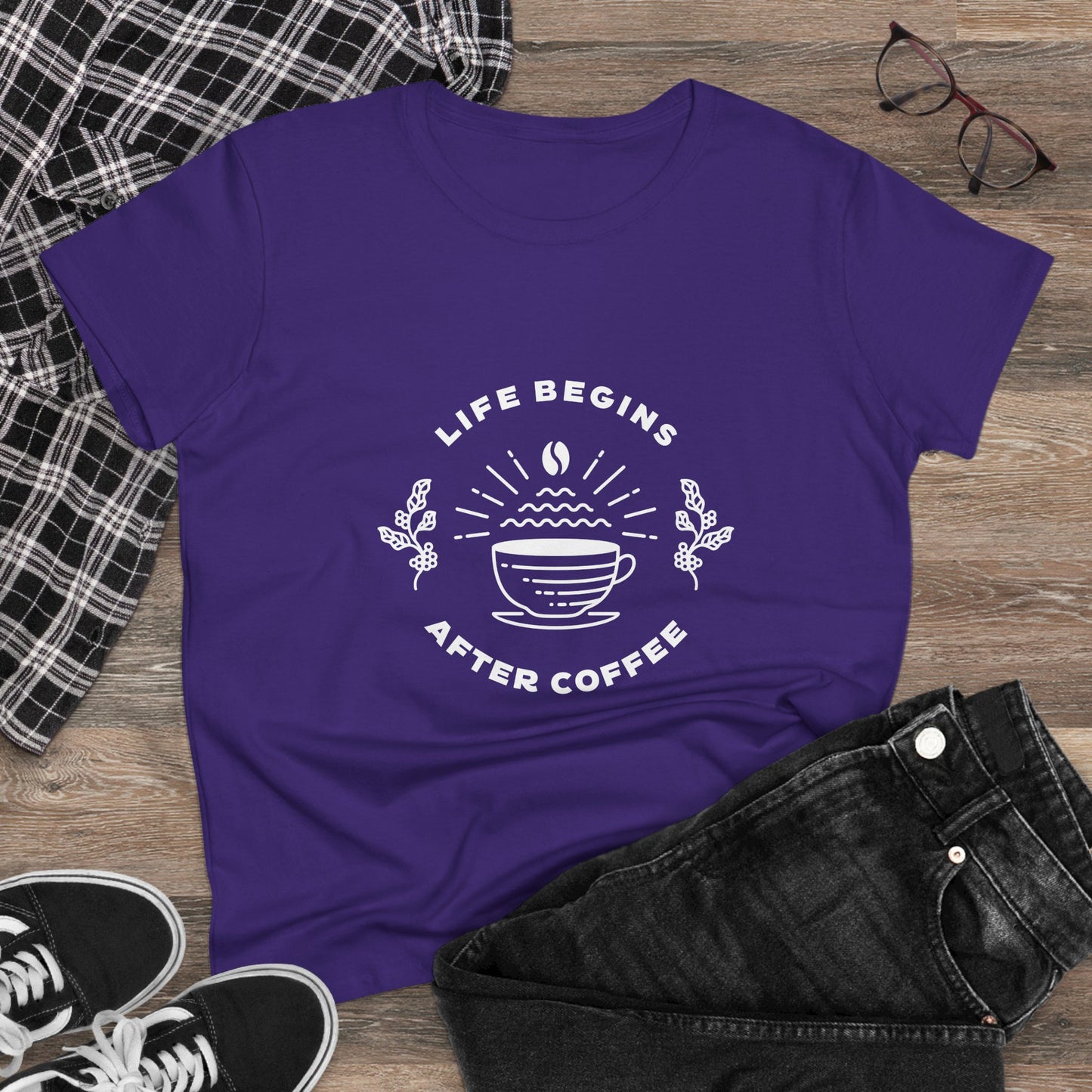 Purple but first coffee t shirt with life begins after coffee design laid flat with jeans and sneakers