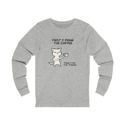 Printify gray long-sleeve but first coffee tee with cat holding coffee cup and text graphic