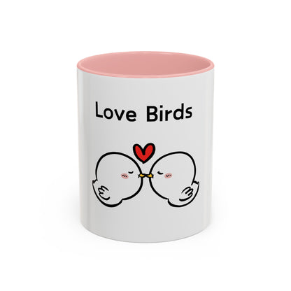 White mug with pink interior featuring cute cartoon mugs design of two love birds kissing with a heart above