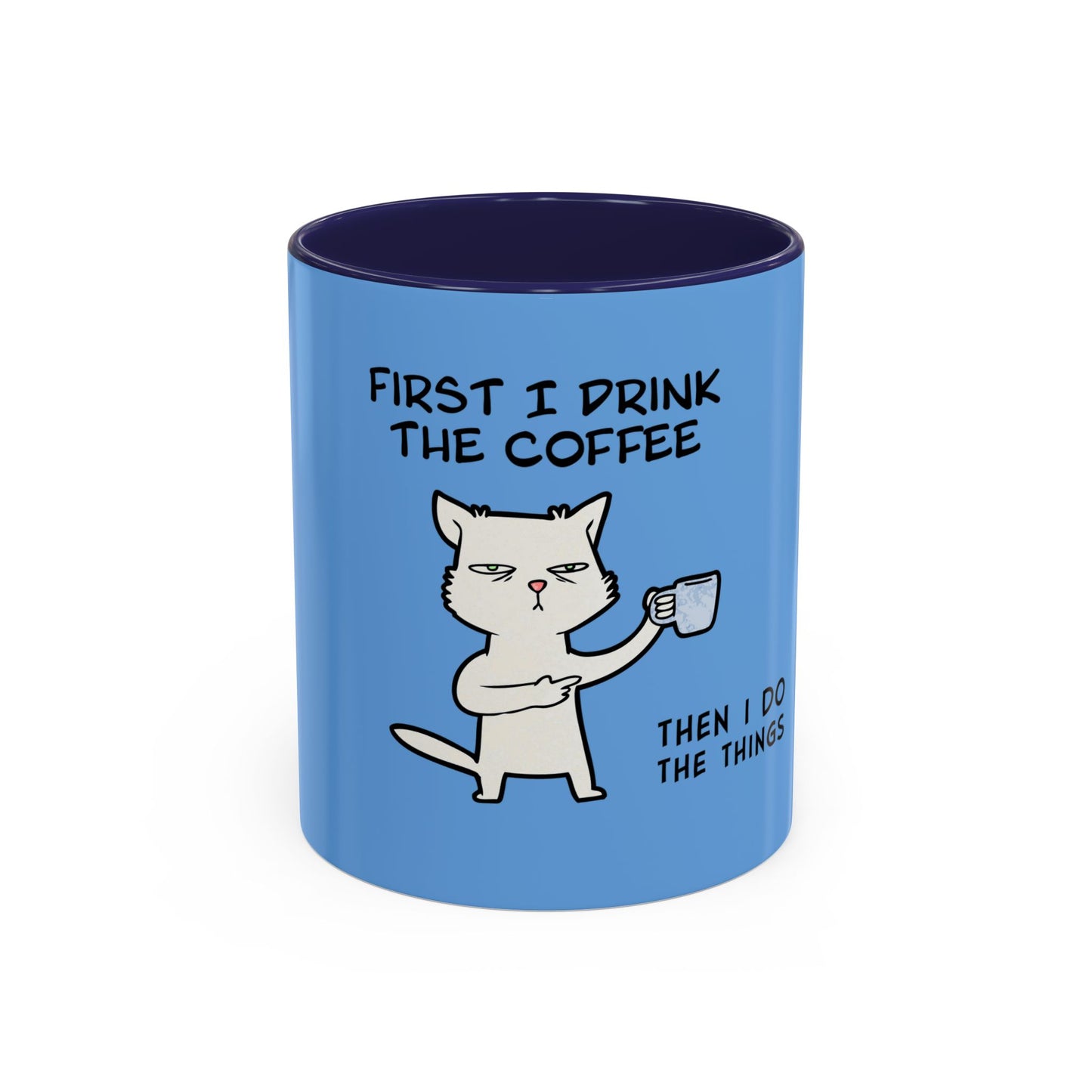 Blue coffee mug with cartoon cat and humorous quote first I drink the coffee then I do the things