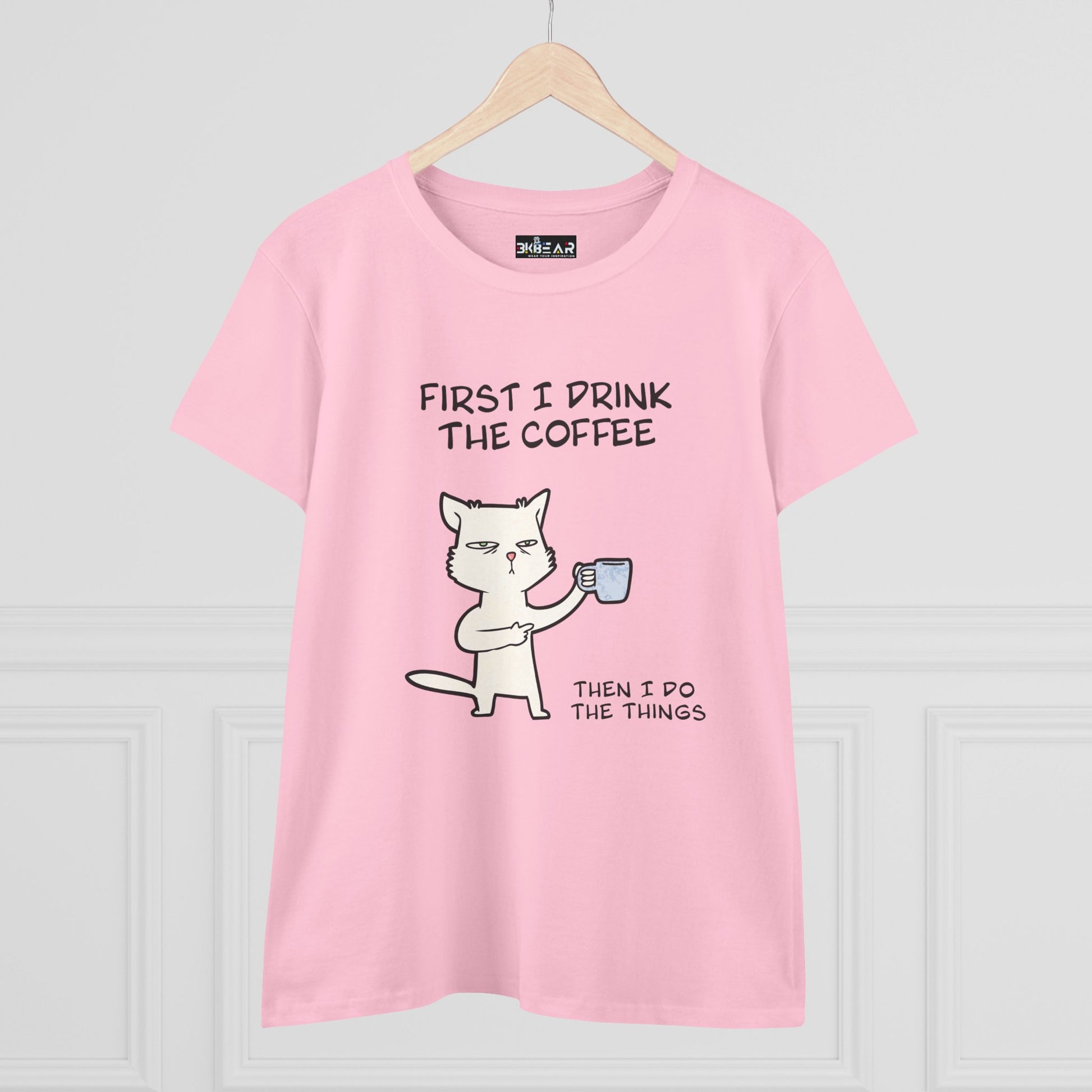 Pink cat coffee shirt with a cute cat illustration holding a coffee mug and humorous text
