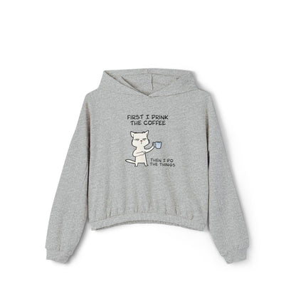 Gray cinch women's hoodie by Printify with cat coffee graphic and text first I drink the coffee then I do the things