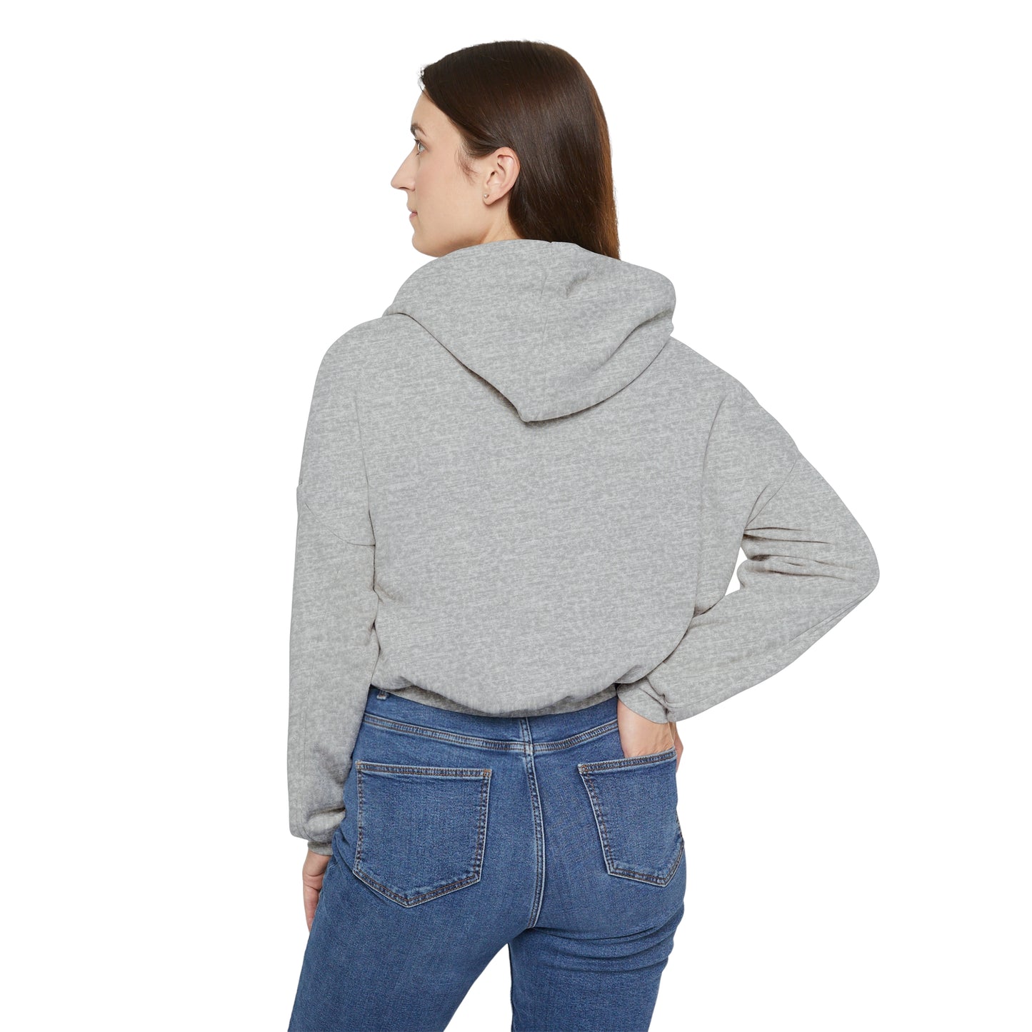 Back view of a woman wearing a light gray Printify cinch women's hoodie with hood up and blue jeans