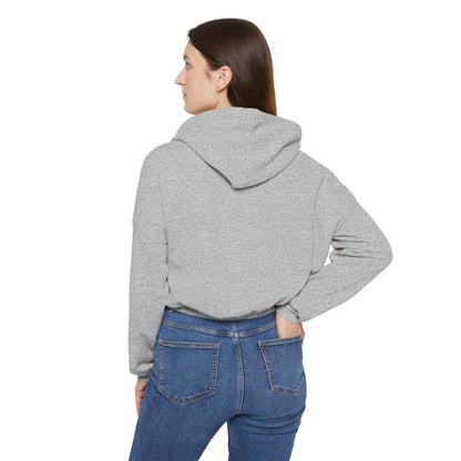 Back view of a woman wearing a light gray Printify cinch women's hoodie with hood up and blue jeans