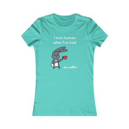 Turquoise Printify T-shirt with cartoon bunny and coffee and tees slogan I turn human after I've had my coffee