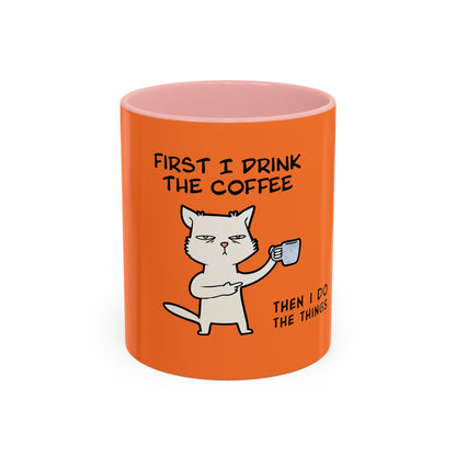 Orange Printify coffee mug with humorous cat and text First I drink the coffee then I do the things