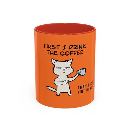 Orange coffee mug by Printify featuring a grumpy cat and text First I drink the coffee then I do the things