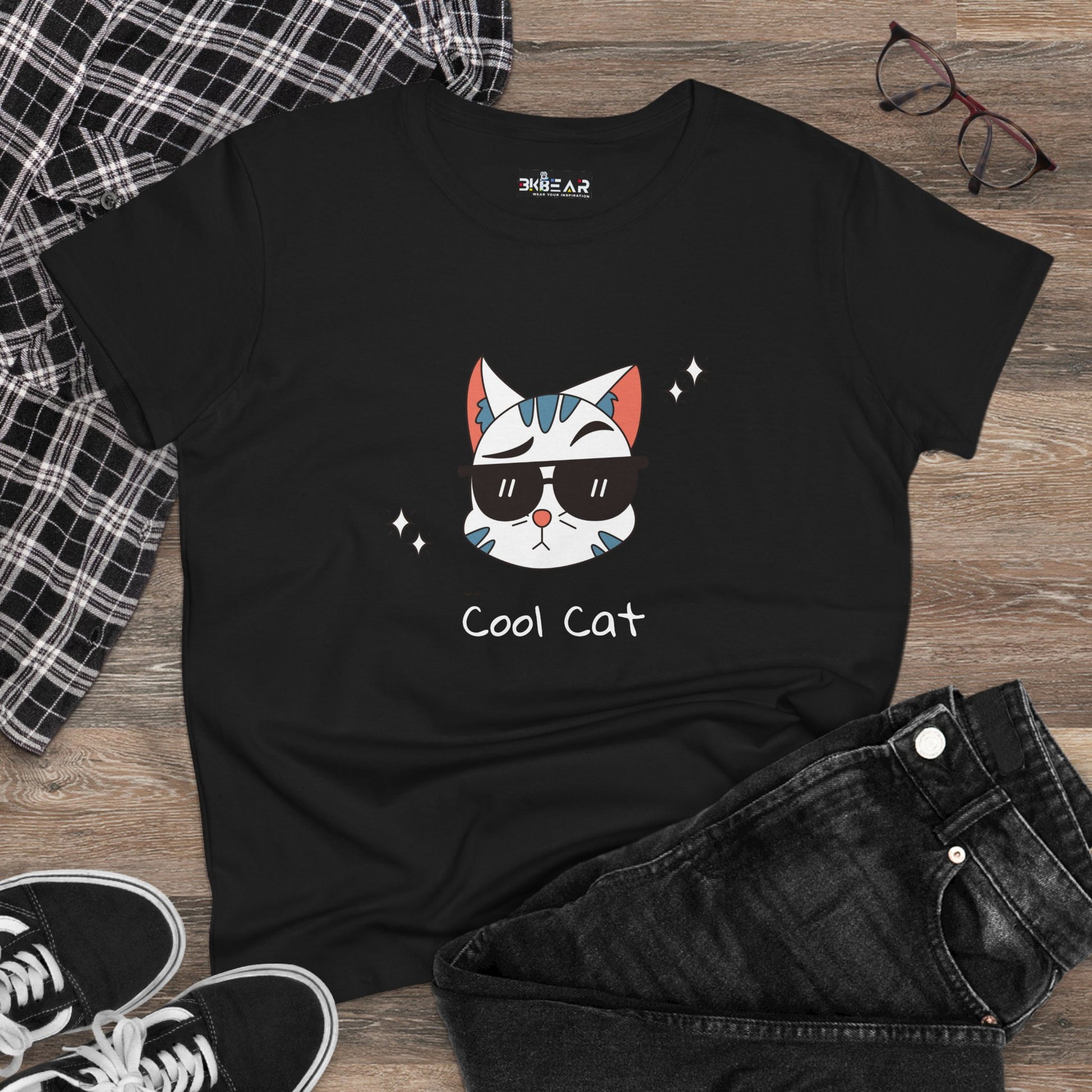 Black cool cat graphic t-shirt for women with cartoon cat wearing sunglasses on wooden background