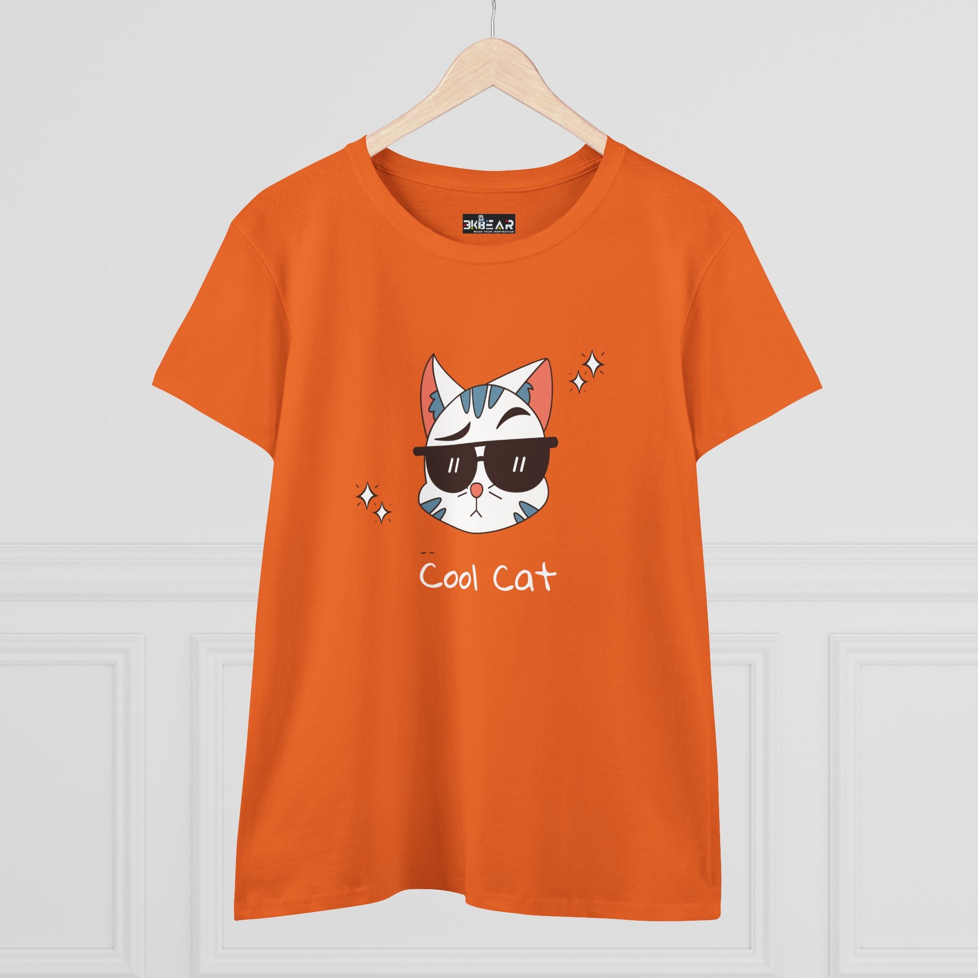 Orange cool cat graphic t-shirt for women featuring a cat with sunglasses and sparkles