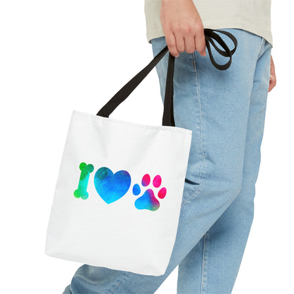 White cute dog lover tote bag with colorful bone heart and paw print design held by person