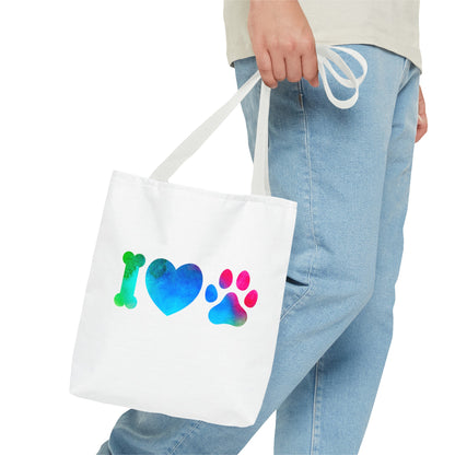 Printify cute dog lover tote bag in white with colorful paw print design held by person