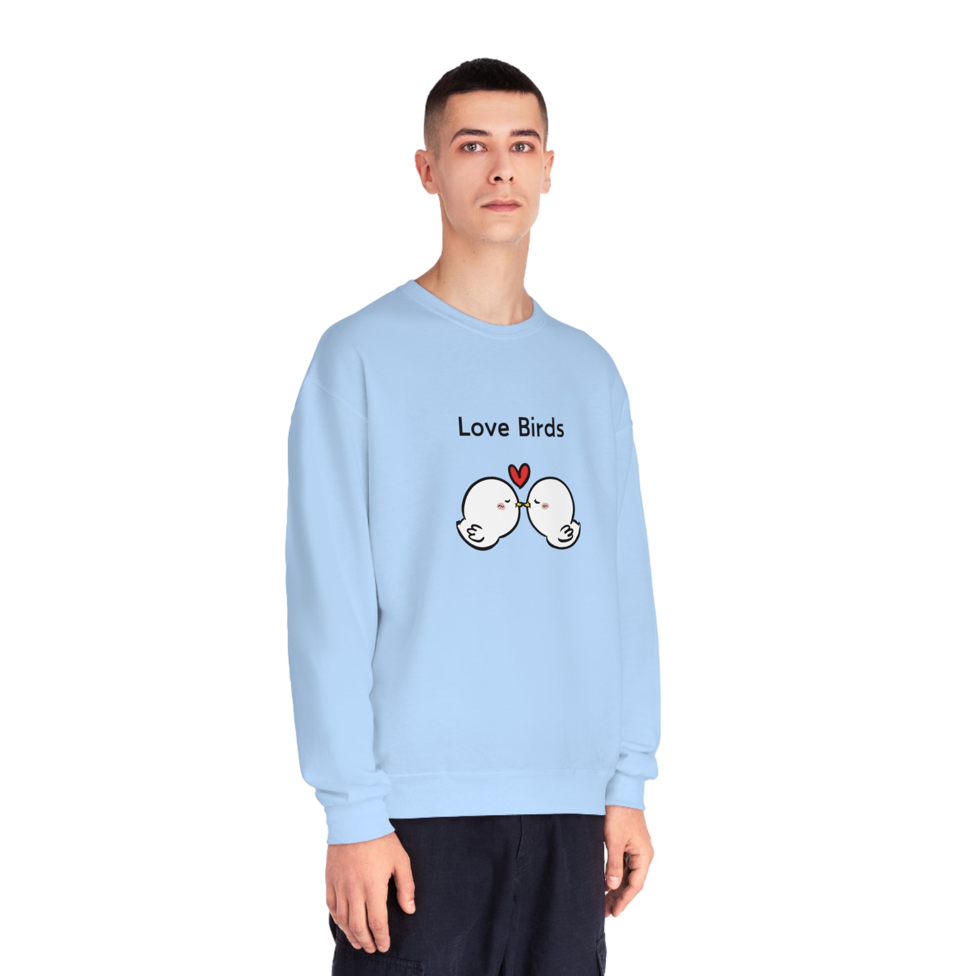 Light blue Printify sweatshirt featuring cute sweatshirts with sayings design of two kissing love birds and a heart