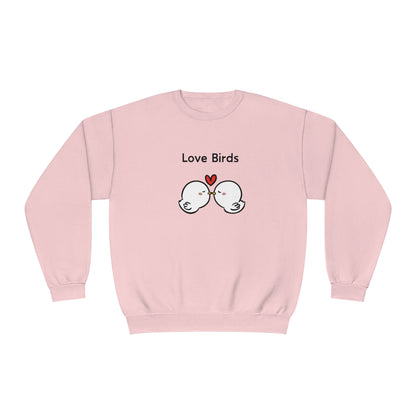 Pink sweatshirt by Printify with cute sweatshirts with sayings featuring two love birds and a heart graphic