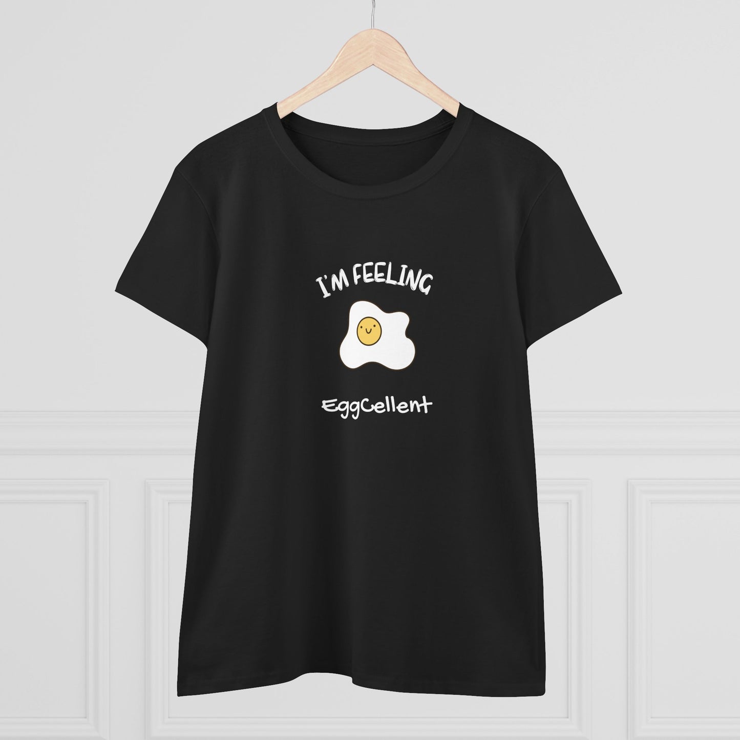 Black Printify T-Shirt with a cheerful fried egg graphic and text I'm feeling eggcellent pun tee