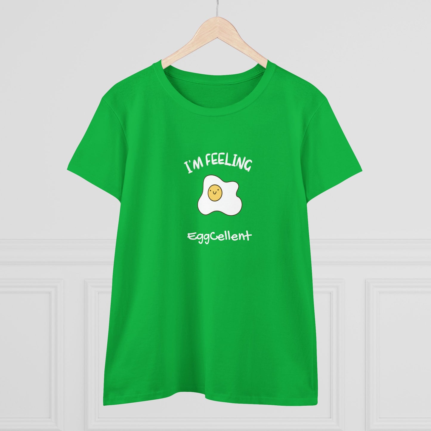 Green Printify t-shirt with smiling fried egg and I'm feeling eggcellent pun tee design