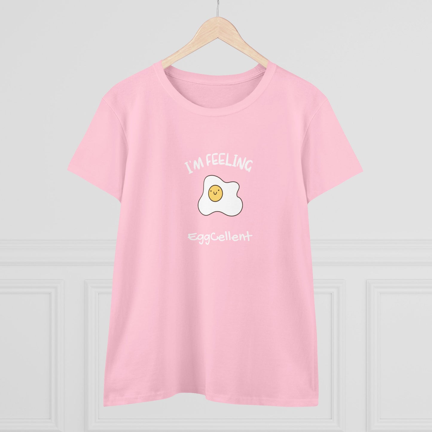 Pink Printify t-shirt with cute fried egg graphic and eggcellent pun tee text design