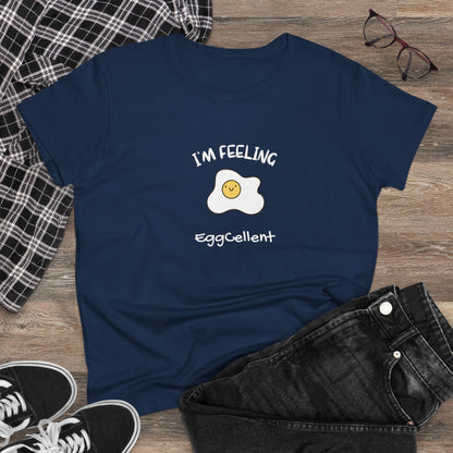 Navy blue eggcellent pun tee with a smiling fried egg and text I'm feeling eggcellent laid flat with jeans and sneakers