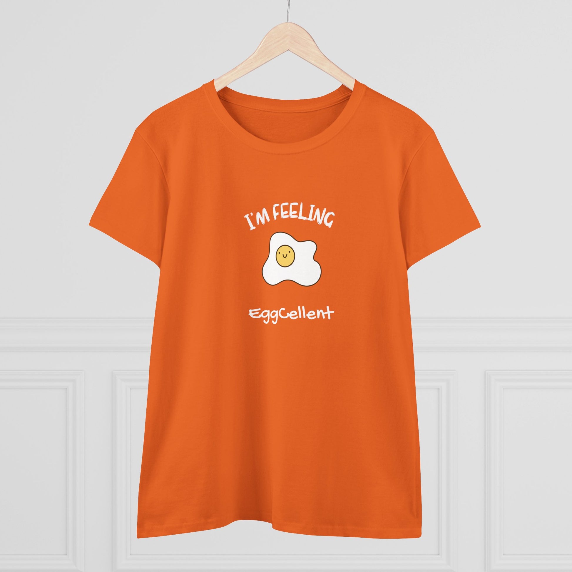 Orange Printify T-Shirt with I'm Feeling Eggcellent pun tee featuring a smiling fried egg graphic