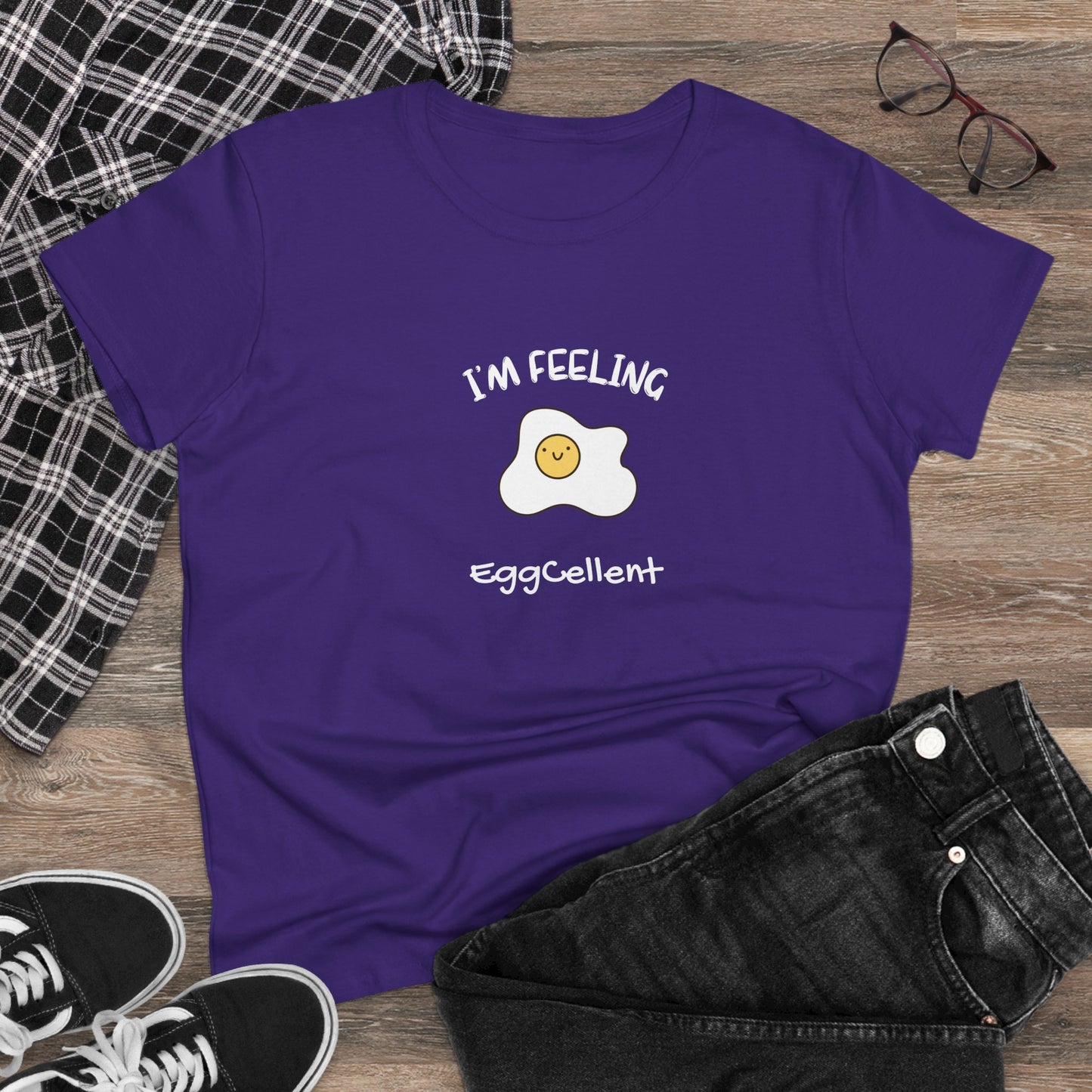 Purple Printify T-Shirt with a smiling fried egg and text I'm feeling eggcellent pun tee design