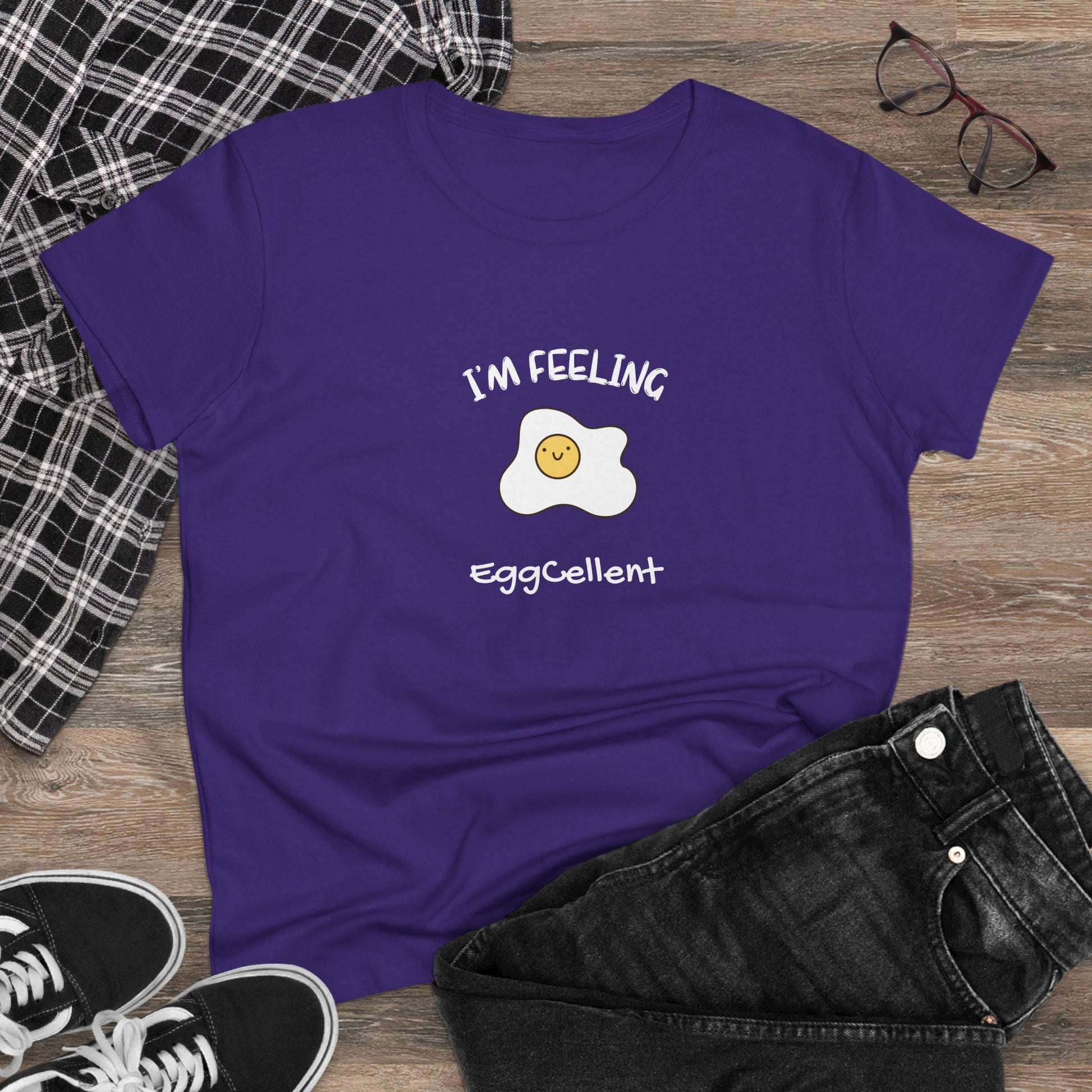 Purple Printify T-Shirt with a smiling fried egg and text I'm feeling eggcellent pun tee design