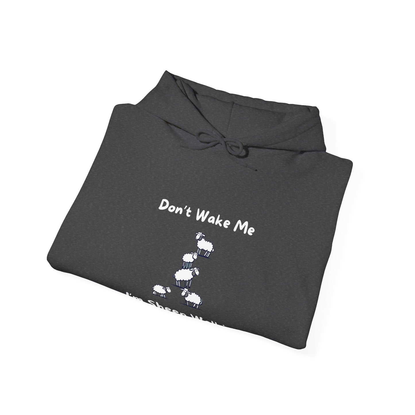 Folded black funny sheep hoodie by Printify with white sheep graphic and Dont Wake Me text