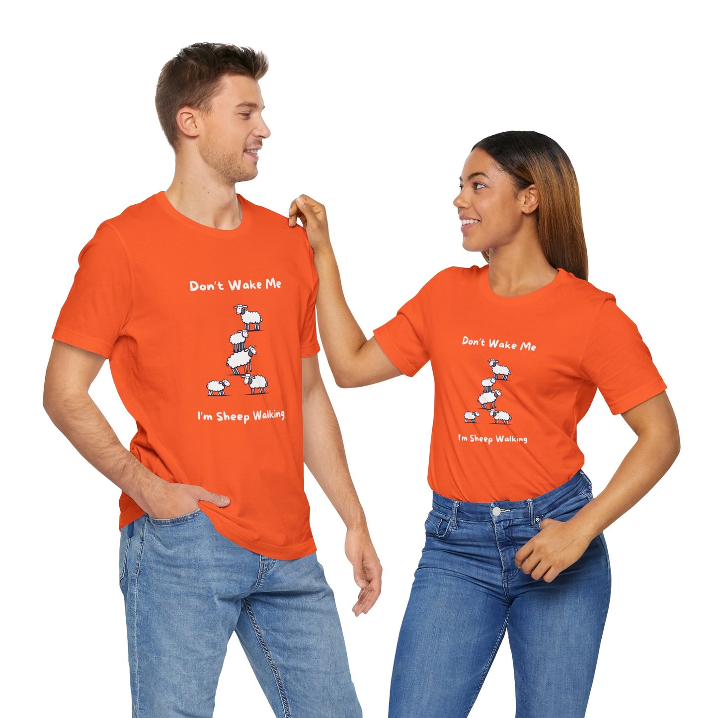 Printify funny sheep shirt in bright orange with sheep cartoon and text worn by man and woman
