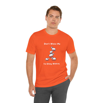 Orange funny sheep shirt with cartoon sheep and humorous text worn by man