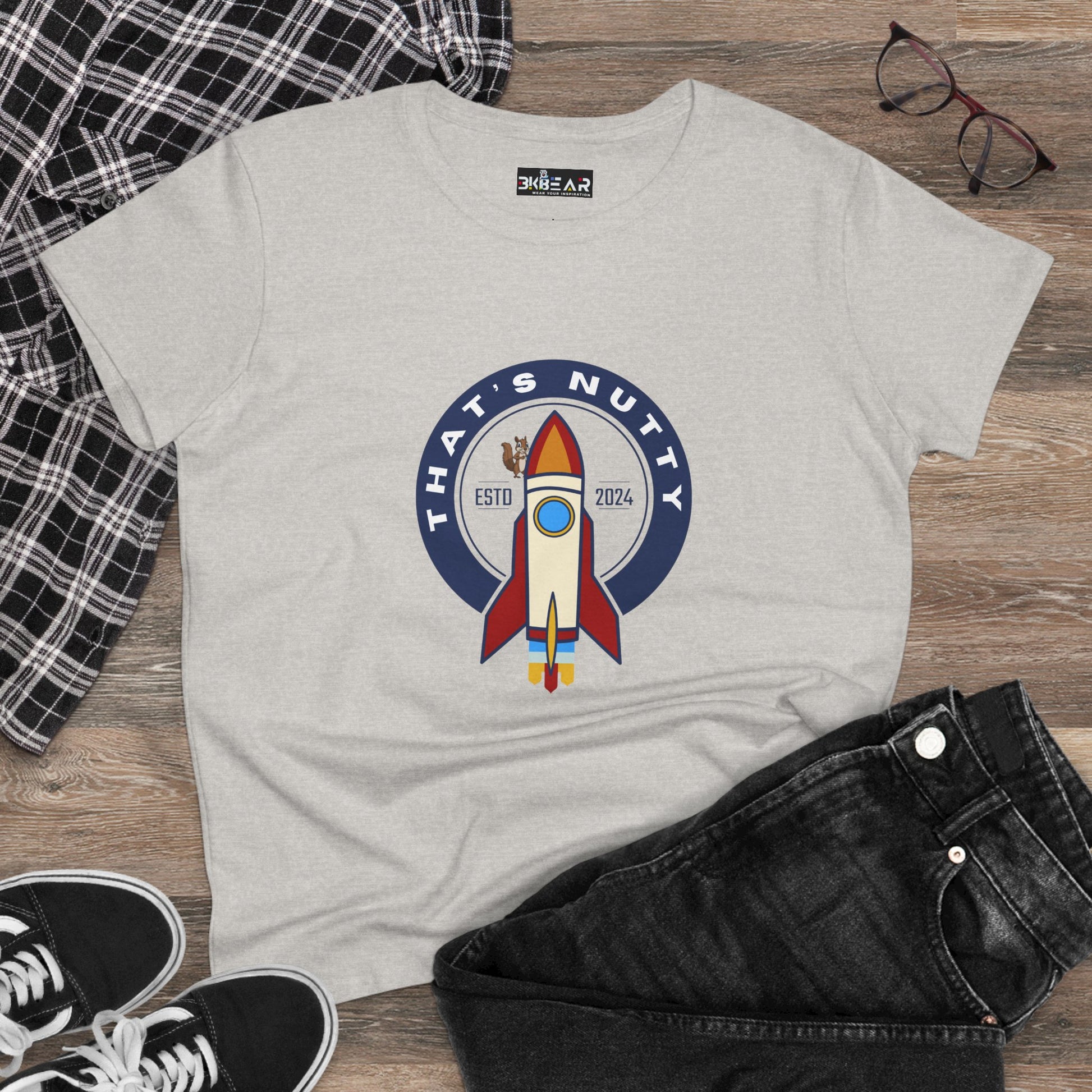 Printify funny space graphic shirt with rocket design and Thats Nutty text in blue and red