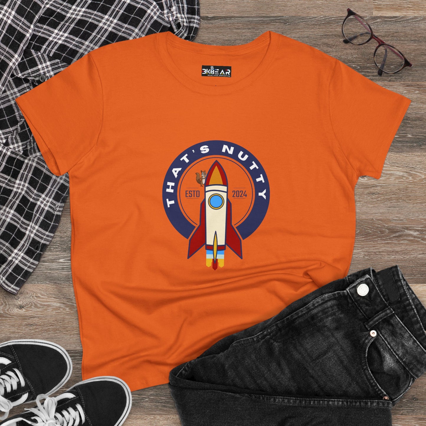 Orange funny space graphic shirt with rocket and that’s nutty text printed on front