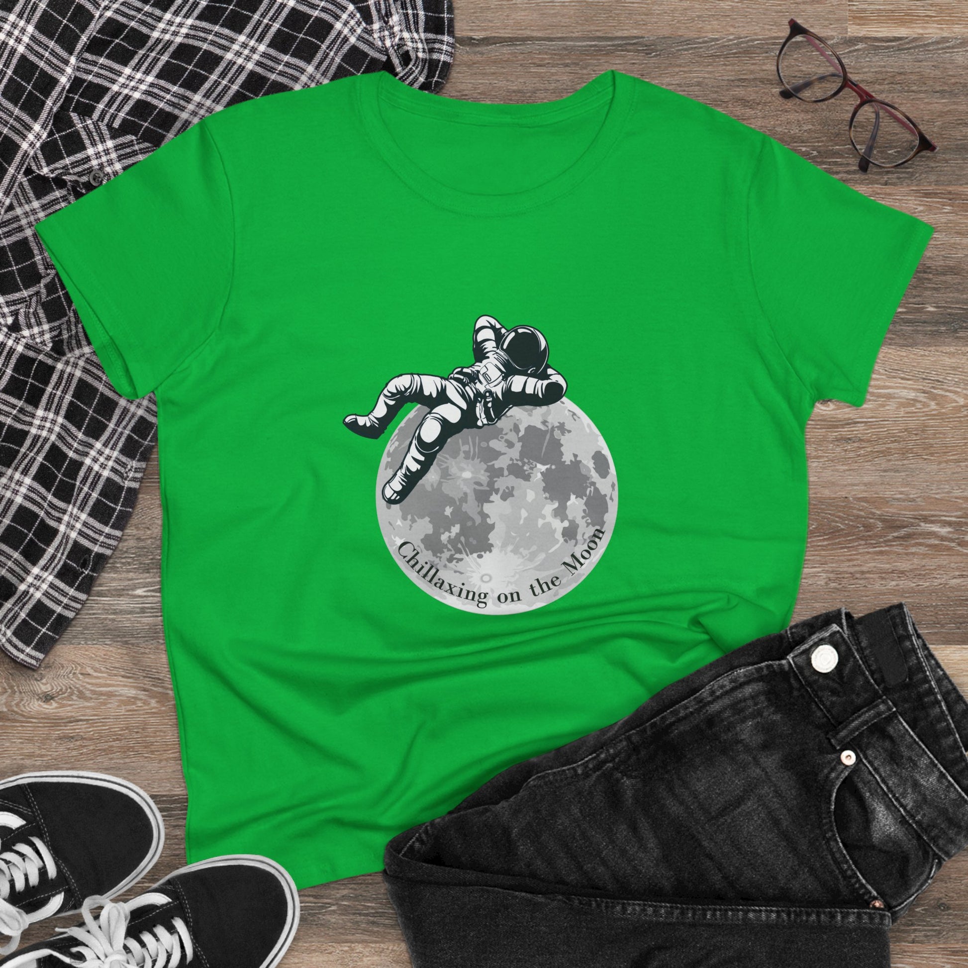 Green moon t-shirt women with astronaut lounging on moon graphic and casual styling