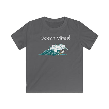 Printify kids ocean vibes t-shirt in gray with surfing penguin and ocean wave graphic