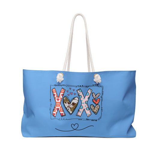 Printify love graphic weekender bag in blue with heart and kiss design and white rope handles