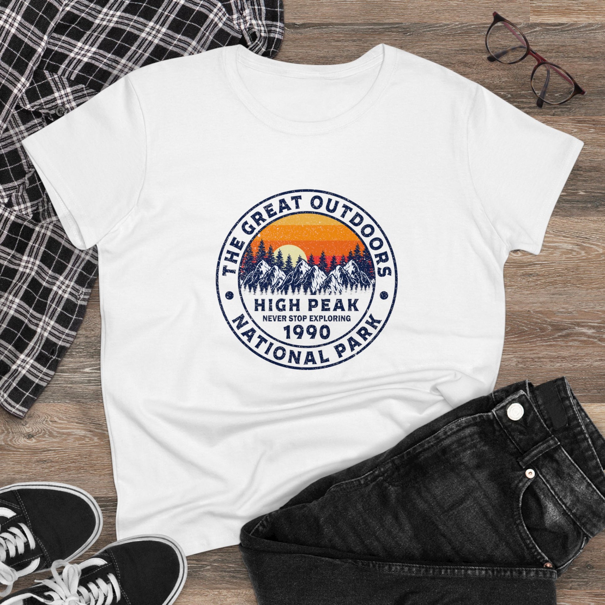White national park t-shirt for women featuring mountain and sunset graphic with The Great Outdoors design